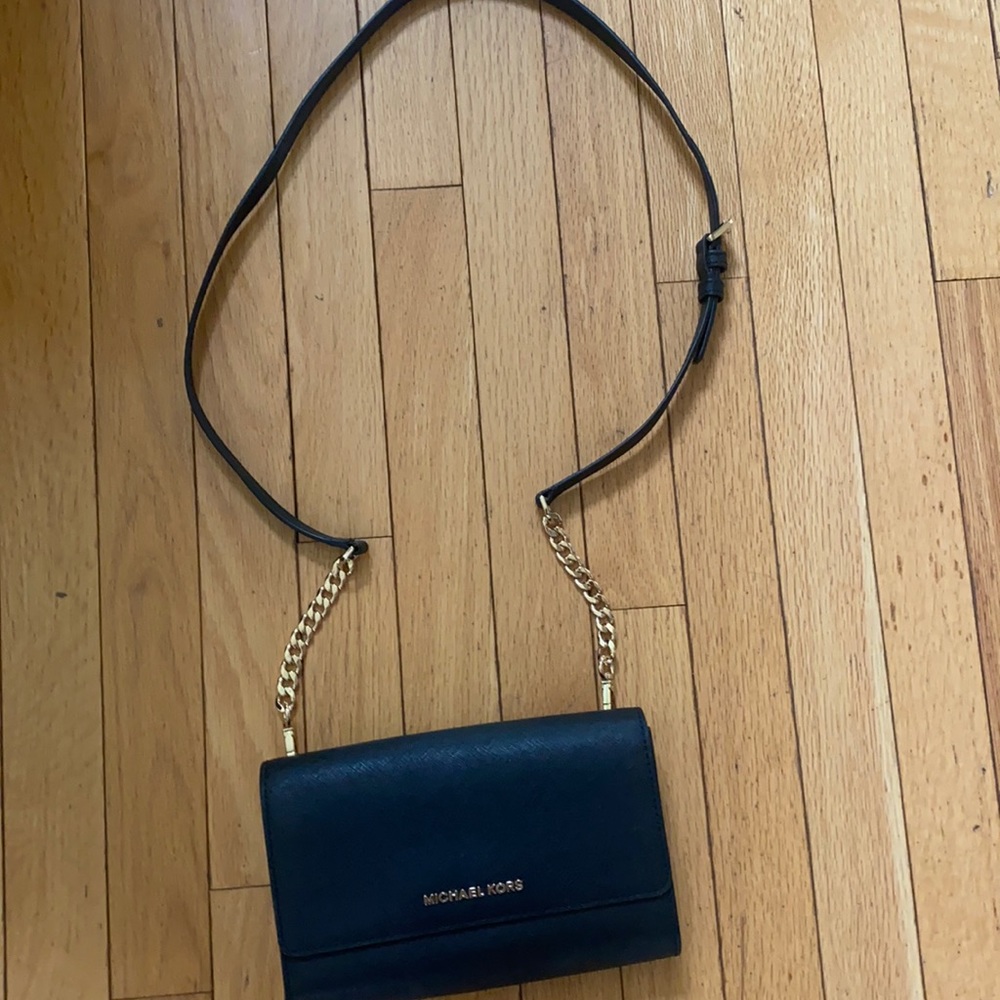 Michael Kors small black purse . In excellent condition. No scratches .